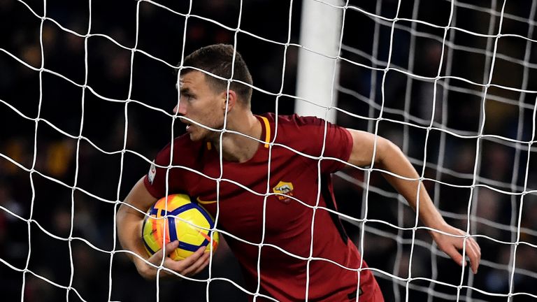 Roma's forward from Bosnia Edin Dzeko celebrates after scoring a goal during the Serie A football match between Roma and Atalanta at The Olympic stadium in