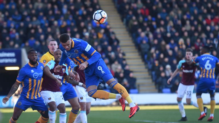Shrewsbury Town's Carlton Morris (C) defends from a corner during the English FA Cup third round match v West Ham