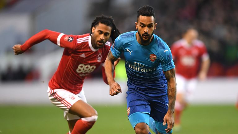 Armand Traore of Nottingham Forest chases down Theo Walcott of Arsenal during The Emirates FA Cup Third Round match at The City Ground