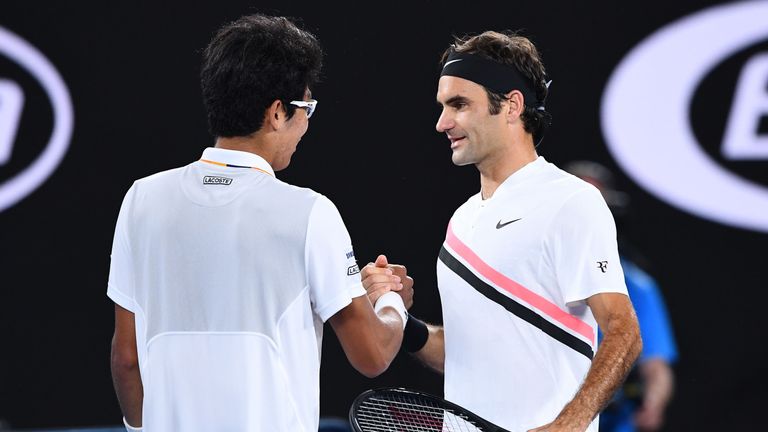 Roger Federer (right) reached the Australian Open final after Hyeon Chung withdrew