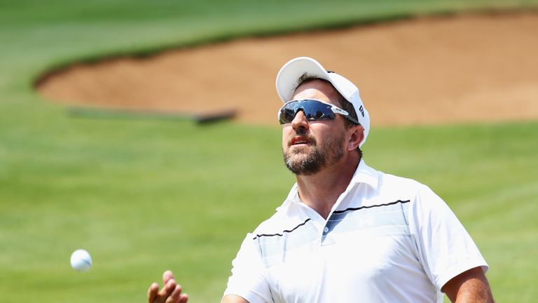 JOHANNESBURG, SOUTH AFRICA - JANUARY 13:  Darren Fichardt of South Africa throws a ball in to the crowd on the 18th green during day three of the BMW South