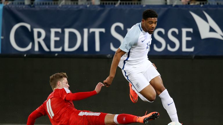THUN, SWITZERLAND - MARCH 26: Jordon Ibe of England U21 (R) competes for the ball with Florian Kamberi of Switzerland U21 during the European Under 21 Qual