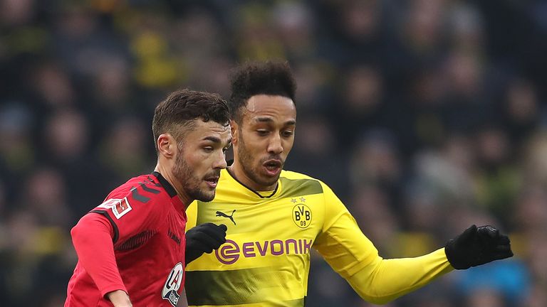 Pierre-Emerick Aubameyang of Borussia Dortmund (r) fights for the ball with Manuel Gulde of Freiburg during the Bundesliga match at Signal Iduna Park