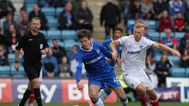 Motherwell striker Curtis Main (r), pictured in action against Gillingham's Bingham while playing for Portsmouth