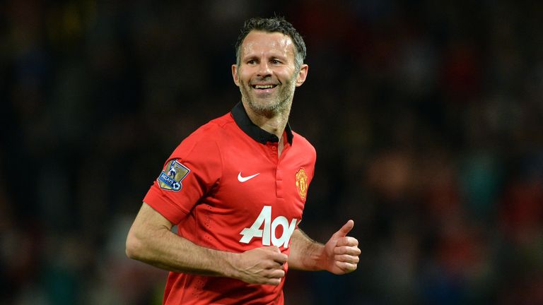 Manchester United's Interim Welsh player-manager Ryan Giggs smiles after taking a free kick during the English Premier League football match between Manche