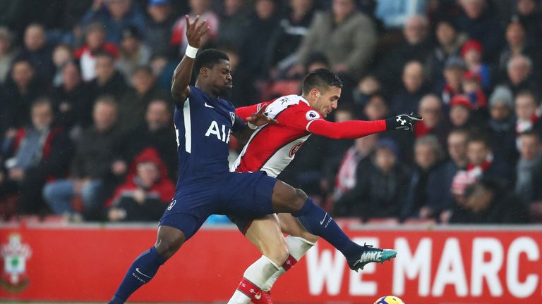 Dusan Tadic of Southampton and Serge Aurier of Tottenham Hotspur battle for the ball during the Premier League match