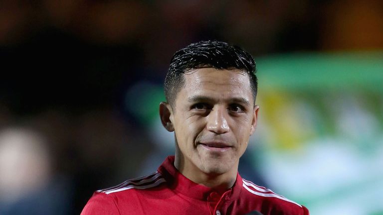 Alexis Sanchez of Manchester United walks out ahead of the Emirates FA Cup Fourth Round match v Yeovil Town at Huish Park