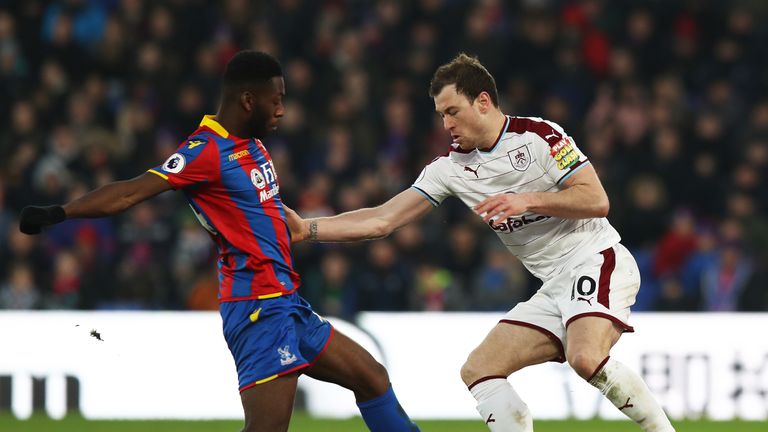 LONDON, ENGLAND - JANUARY 13: Timothy Fosu-Mensah of Crystal Paalce tackles Ashley Barnes of Burnley during the Premier League match between Crystal Palace