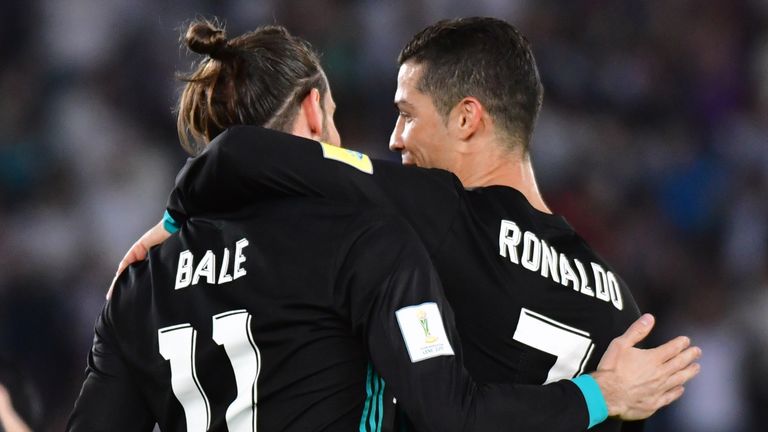Real Madrid's Gareth Bale (L) is congratulated after scoring by team-mate Cristiano Ronaldo (R) during the FIFA Club World Cup semi-final v Al Jazira