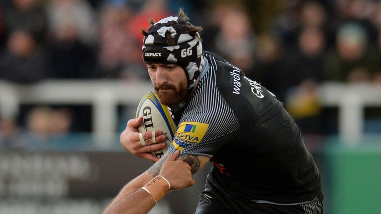 NEWCASTLE UPON TYNE, ENGLAND - DECEMBER 23: Gary Graham of Newcastle Falcons is tackled by Alofa Alofa of Harlequins during the Aviva Premiership match bet