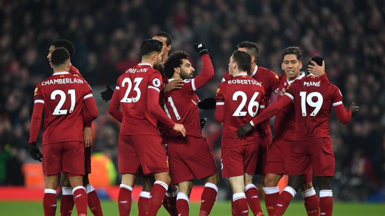 LIVERPOOL, ENGLAND - JANUARY 14: Mohamed Salah of Liverpool celebrates with team mates after scoring the fourth Liverpool goal during the Premier League ma