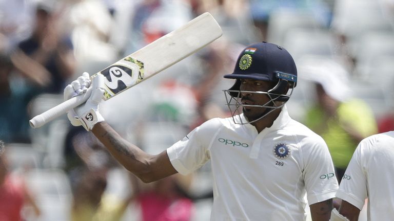 Indian batsman Hardik Pandya raises his bat as he celebrates scoring half century (50 runs) during the second day of the first Test cricket match between S