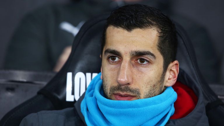 Henrikh Mkhitaryan takes his place on the bench ahead of the Premier League match between Swansea City and Arsenal at The Liberty Stadium