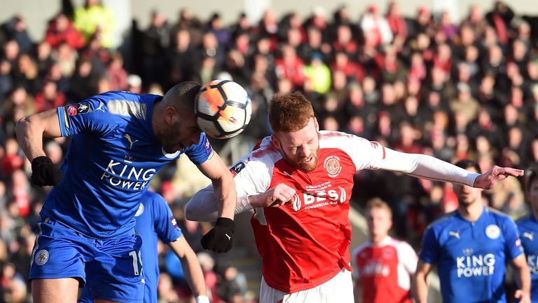 Leicester City's Algerian striker Islam Slimani (L) defends a corner from Fleetwood Town's Irish defender Cian Bolger during the English FA Cup third round