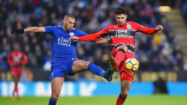 Islam Slimani challenges Christopher Schindler during the Premier League match between Leicester and Huddersfield