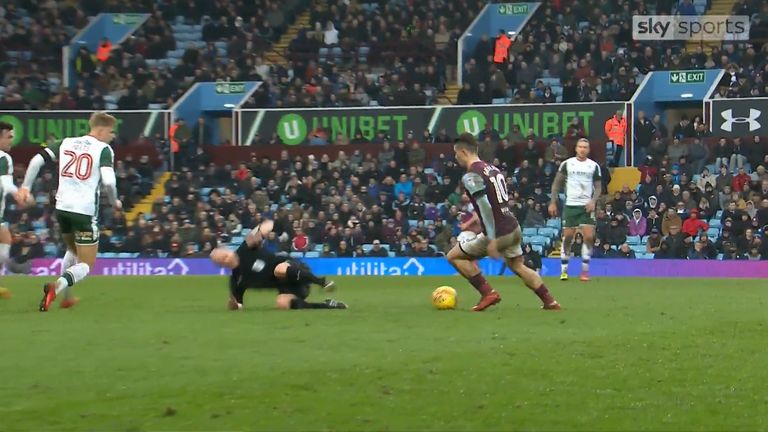 Referee Scott Duncan takes a tumble after a barge from Jack Grealish