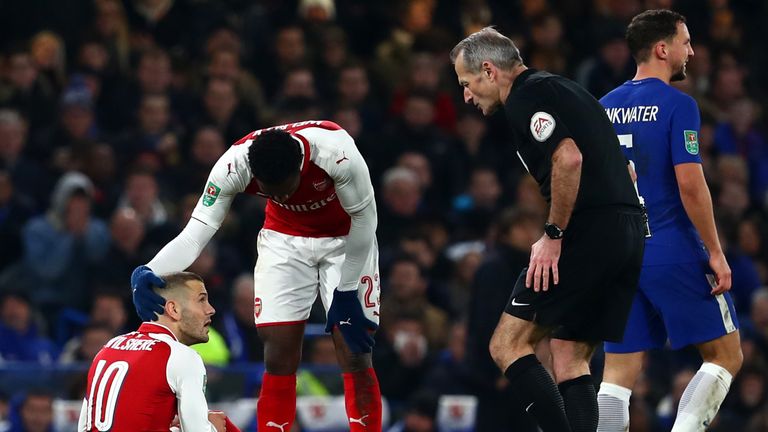 LONDON, ENGLAND - JANUARY 10:  An injured Jack Wilshere of Arsenal reacts during the Carabao Cup Semi-Final First Leg match between Chelsea and Arsenal at 