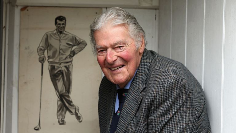 LYNDHURST, ENGLAND - JULY 03:  John Jacobs of England poses for a photograph next to a charcoal drawing of himself at his home on July 3, 2012 in Lyndhurst