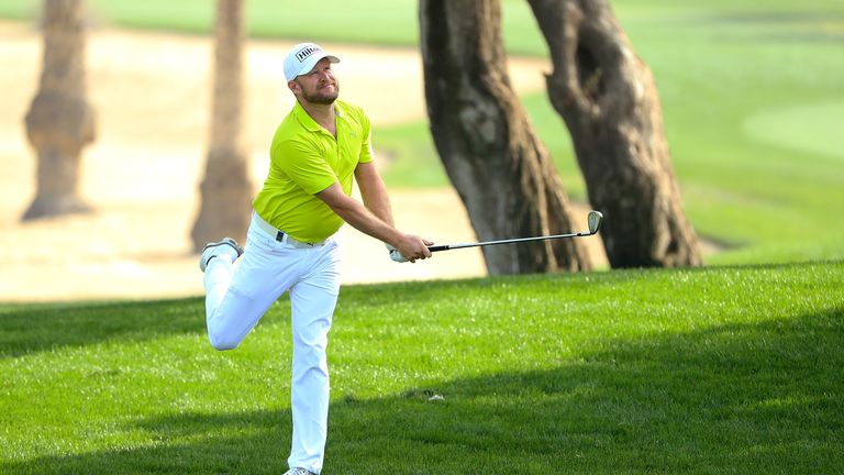 DUBAI, UNITED ARAB EMIRATES - JANUARY 25: Jamie Donaldson of England hits his second shot on the 16th hole during round one of the Omega Dubai Desert Class