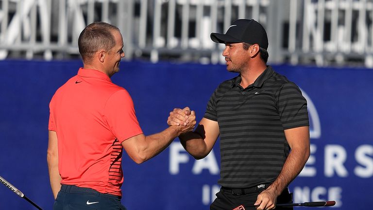 SAN DIEGO, CA - JANUARY 29:   Jason Day of Australia shakes hands with Alex Noren of Sweden on the sixth playoff on the 18th green after winning the Farmer