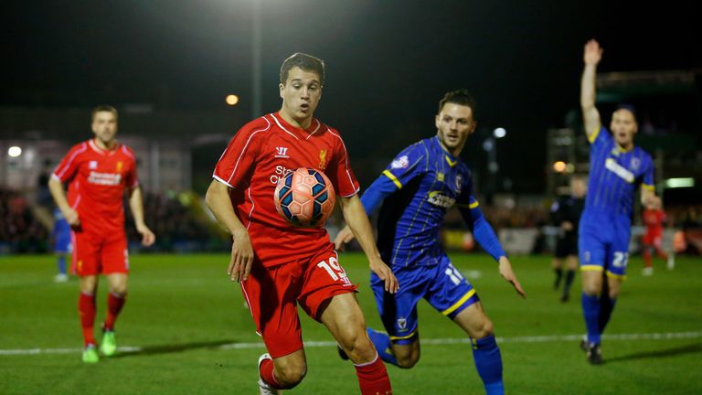 KINGSTON UPON THAMES, ENGLAND - JANUARY 05:  Javi Manquillo of Liverpool controls the ball as Callum Kennedy of AFC Wimbledon closes in during the FA Cup T