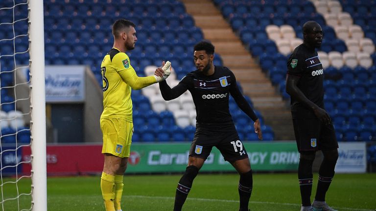 COLCHESTER, ENGLAND - AUGUST 09:  Aston Villa goalkeeper Jed Steer celebrates with Andre Green after saving a penalty during the Carabao Cup First Round