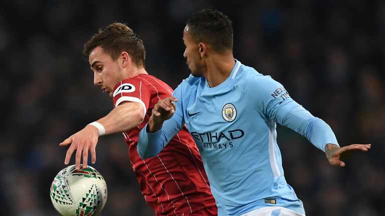Joe Bryan (L) vies with Danilo during the Carabao Cup semi-final first leg between Manchester City and Bristol City