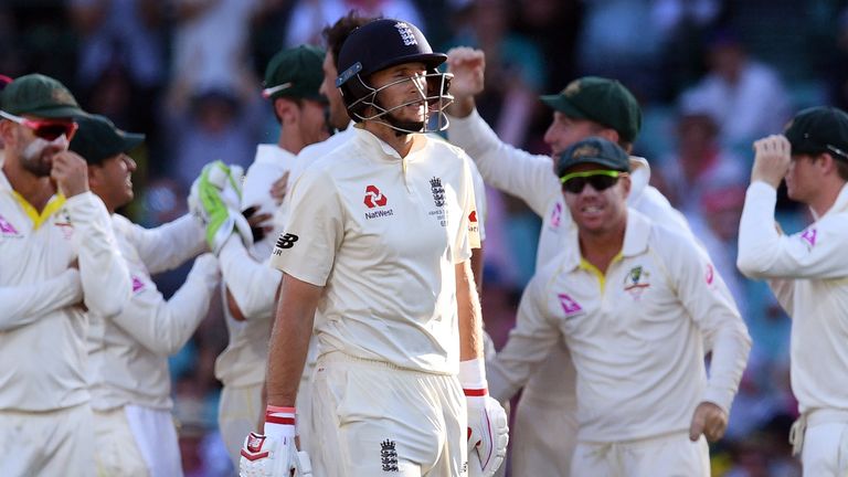England batsman Joe Root (C) reacts after being dismissed by Austalia on the first day of the fifth Ashes cricket Test match at the SCG in Sydney on Januar