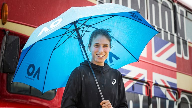 Johanna Konta poses for a photo in front of a double decker bus, ahead of the 2018 Australian Open at Melbourne Park