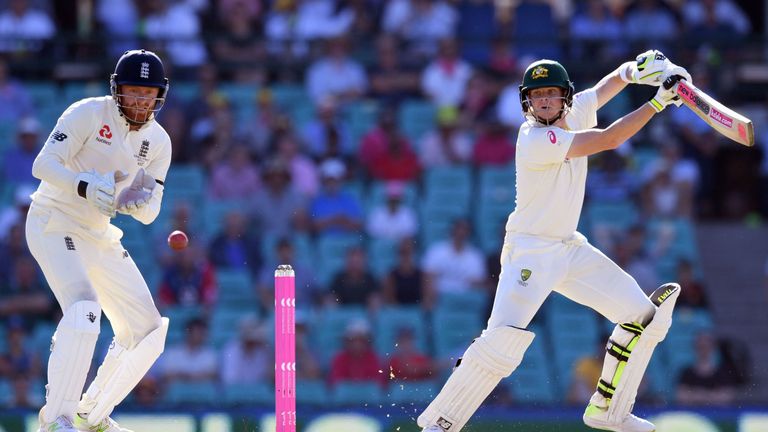 Australia's batsman Steve Smith (R) cuts the ball past England's wicketkeeper Jonny Bairstow on the second day of the fifth Ashes cricket Test match at the