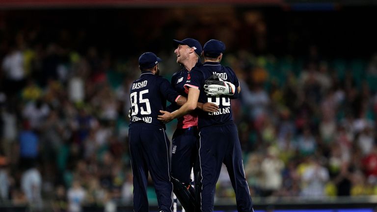 SYDNEY, AUSTRALIA - JANUARY 21: Jos Buttler of England and his team-mates celebrate victory in game three of the One Day International series between Austr