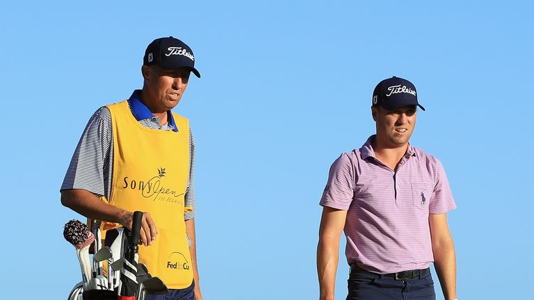 HONOLULU, HI - JANUARY 11:  Justin Thomas of the United States stands with caddie Jim "Bones" Mackay on the 17th tee during round one of the Sony Open In H