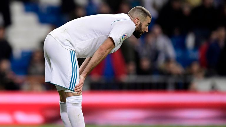 Real Madrid's French forward Karim Benzema bends at the end of the Spanish 'Copa del Rey' (King's cup) quarter-final second leg football match between Real