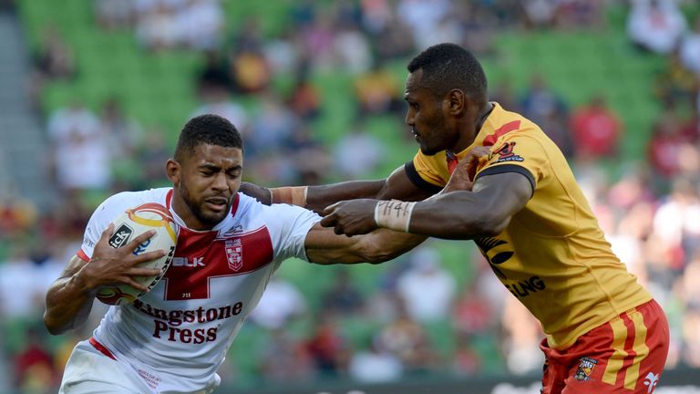 England Kallum Watkins (L) is tackled by Kato Ottio of Papua New Guinea during their Rugby League World Cup quarter-final match between England and Papua N