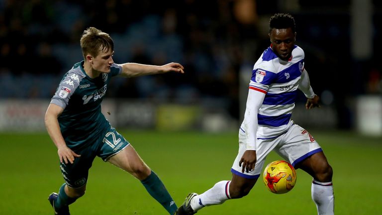 LONDON, ENGLAND - FEBRUARY 21:  Kazenga LuaLua of Queens Park Rangers is tracked by Callum Connolly of Wigan during the Sky Bet Championship match between 