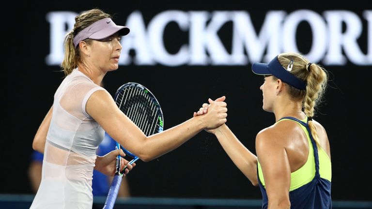 MELBOURNE, AUSTRALIA - JANUARY 20:  Angelique Kerber of Germany is congratulated by Maria Sharapova of Russia after their third round match on day six of t