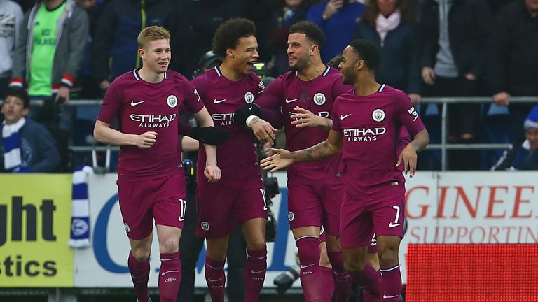 Kevin De Bruyne (L) celebrates with his Man City team-mates