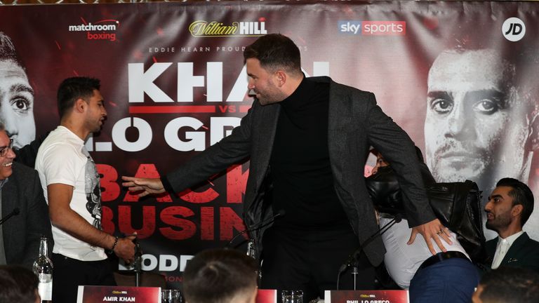 Amir Khan throws a glass of water over Phil Le Greco