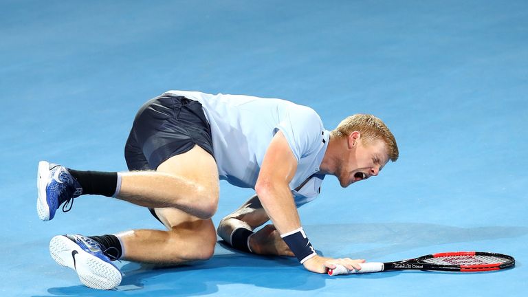 Kyle Edmund of Great Britain falls in his match against Grigor Dimitrov of of Bulgaria during day six of the 2018 Brisbane Open