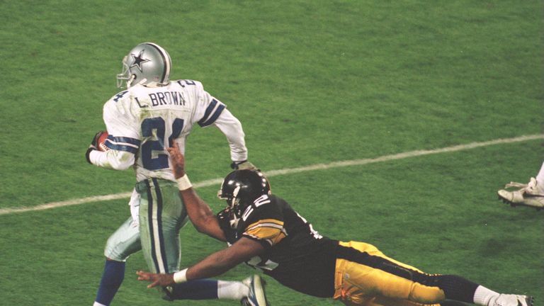 28 Jan 1996:  Cornerback Larry Brown #24 of the Dallas Cowboys is knocked out of bounds by running back John L. Williams #22 of the Pittsburgh Steelers dur