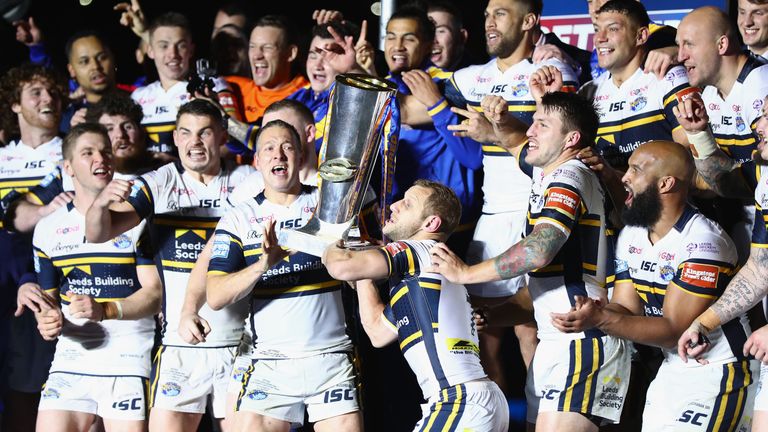 Leeds Rhinos' Danny McGuire and Rob Burrow lift the Betfred Super League trophy after defeating Castleford Tigers in the 2017 Grand Final