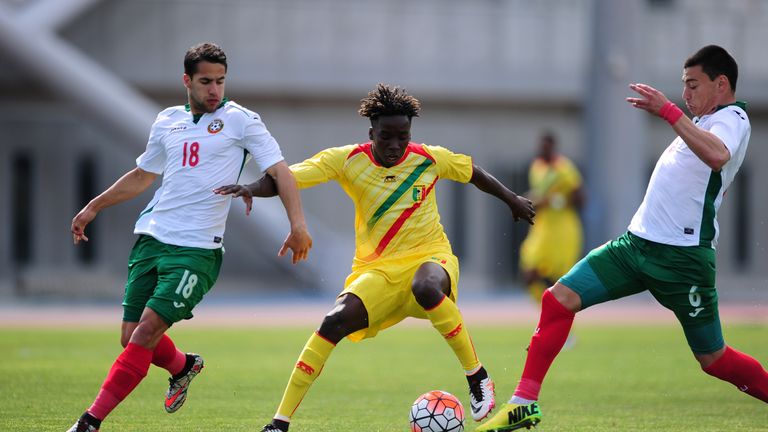 TOULON, FRANCE - MAY 26: Fousseni Diabate of Mali is tackled by Borislav Tsonev of Bulgaria during the Toulon Tournament match between Mali and Bulgaria at