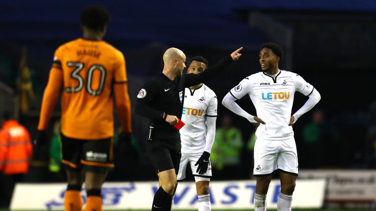 Leroy Fer of Swansea City gets a red card from referee, Anthony Taylor 