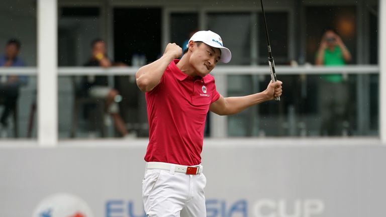 KUALA LUMPUR, MALAYSIA - JANUARY 12: Haotong Li of Asia celebrates halving his match during the fourballs matches on day one of the 2018 EurAsia Cup presen