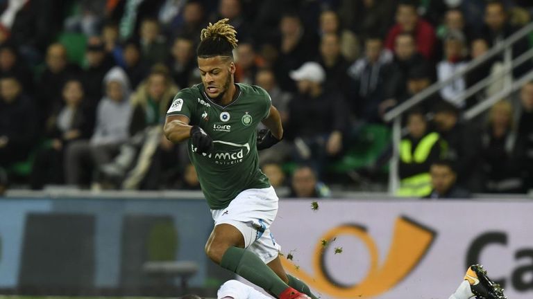 Saint-Etienne forLois Diony (TOP) battles Strasbourg's Jean-Eudes Aholou during a Ligue 1 clash at The Geoffroy Guichard Stadium in Saint-Etienne