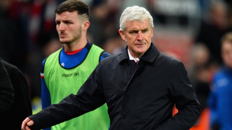 Mark Hughes looks dejected after the 3-0 home defeat West Ham United on December 16, 2017