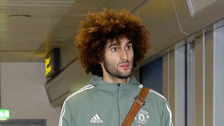 Marouane Fellaini at Manchester Airport ahead of a flight to Dubai for a warm-weather training camp