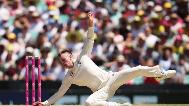 Mason Crane of England fields off his own bowling during day two of the Fifth Test match in the 2017/18 Ashes Series