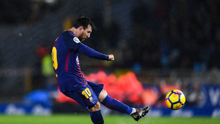 SAN SEBASTIAN, SPAIN - JANUARY 14: Lionel Messi of FC Barcelona scores his team's fourth goal during the La Liga match between Real Sociedad and FC Barcelo