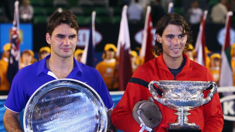 MELBOURNE, AUSTRALIA - FEBRUARY 01:  Roger Federer of Switzerland and Rafael Nadal of Spain pose with their trophies after the men's final match during day